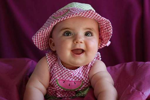 image of a baby in pink hat