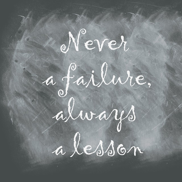 Never a Failure , Always Lessons hand written onto chalkboard