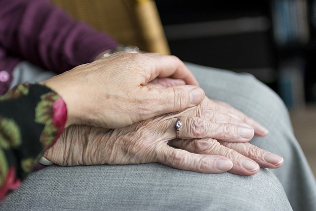 womens hand with young hand on top of older womans hands